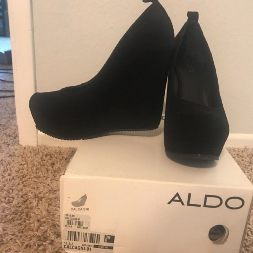 Aldo "Calcagni" black platform heels.